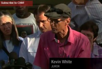 CNN calls the juror Kevin White. The black juror is wearing a T-shirt with "Legendary King of Pop" written on it