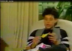 Corey Haim also gets his chicken key chain and thanks the host for the present